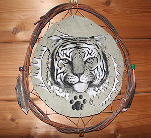 "Kuma" Native American style pen and ink, and white acryllic on suede shield with willow switch hoop frame.